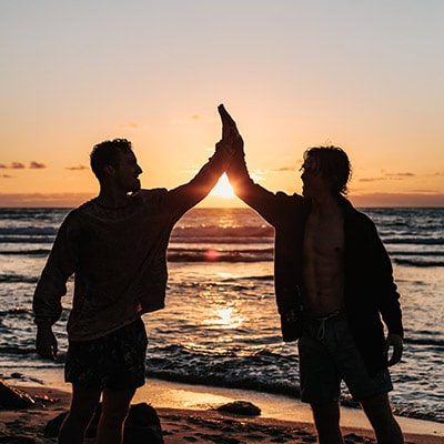 Services - A couple of people that are standing in front of a sunset - Chargeback