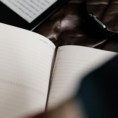 Services - A book sitting on top of a desk - Coach Training